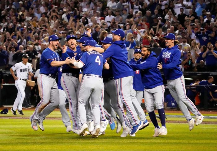 The Texas Rangers celebrate after defeating the Arizona Diamondbacks in Game 5 to become the 2023 World Series champions at Chase Field on Nov 1, 2023.